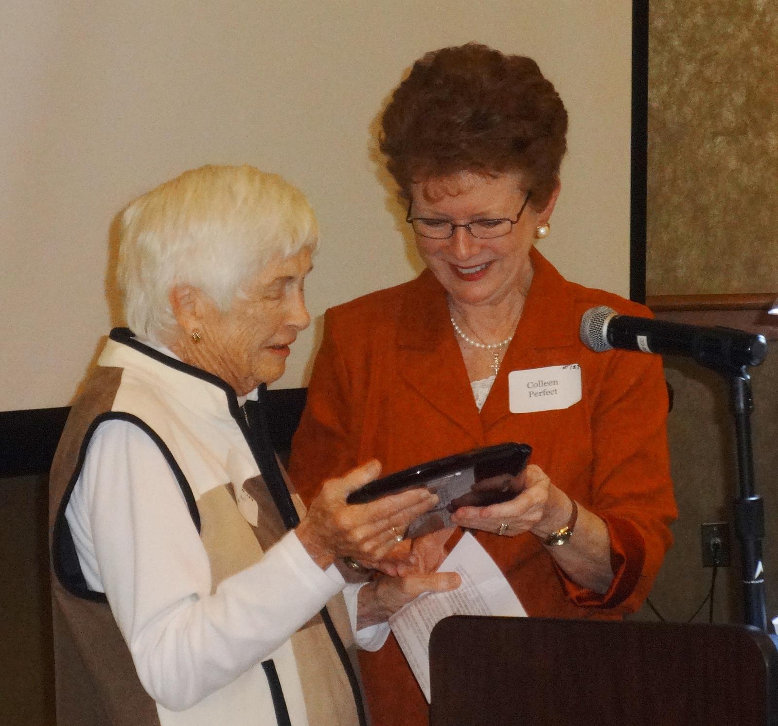Colleen Perfect, President of CPO presenting Marlene Reid with the 2015 Arthur A. Herkenhoff award.
