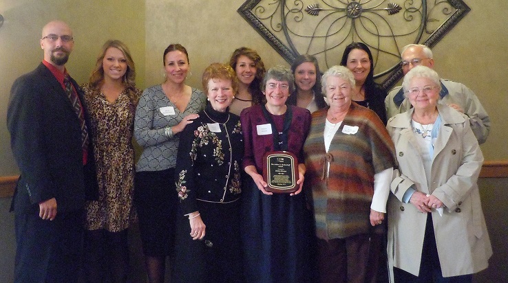 Debra Braun with Herkenhoff family members. Left to Right: Joe Herkenhoff (son), Grace Olund (grand-daughter), Mary Mattheison (daughter), Colleen Perfect, CPO President, Emma Mattheison (grand-daughter), Debra Braun, Meghan Mattheison (grand-daughter), Kathy Herkenhoff (Art’s wife), Meghan Habisch (daughter), Dick Larson (brother-in-law), Liz Larson (sister-in-law).